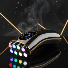7-in-1 EMS facial massager with glowing LED tips on dark moody background with gold accent lighting